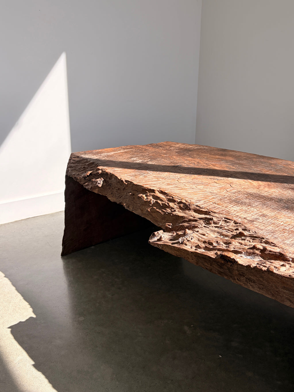 Raw live edge timber coffee table front view showing raw edges