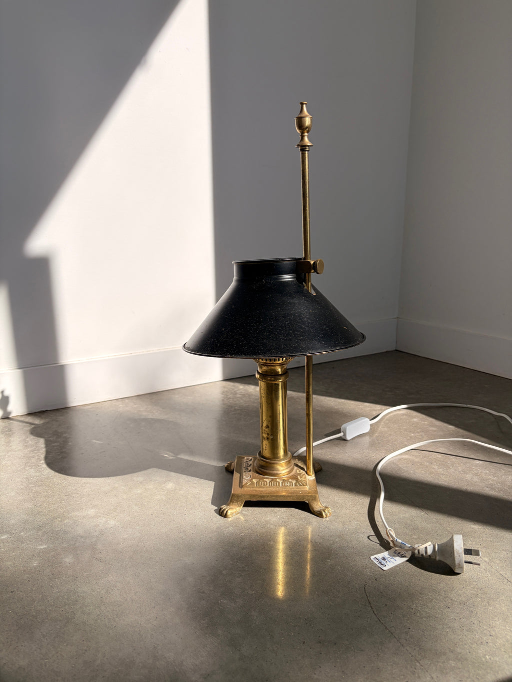 Vintage brass bouillotte lamp with black shade full view