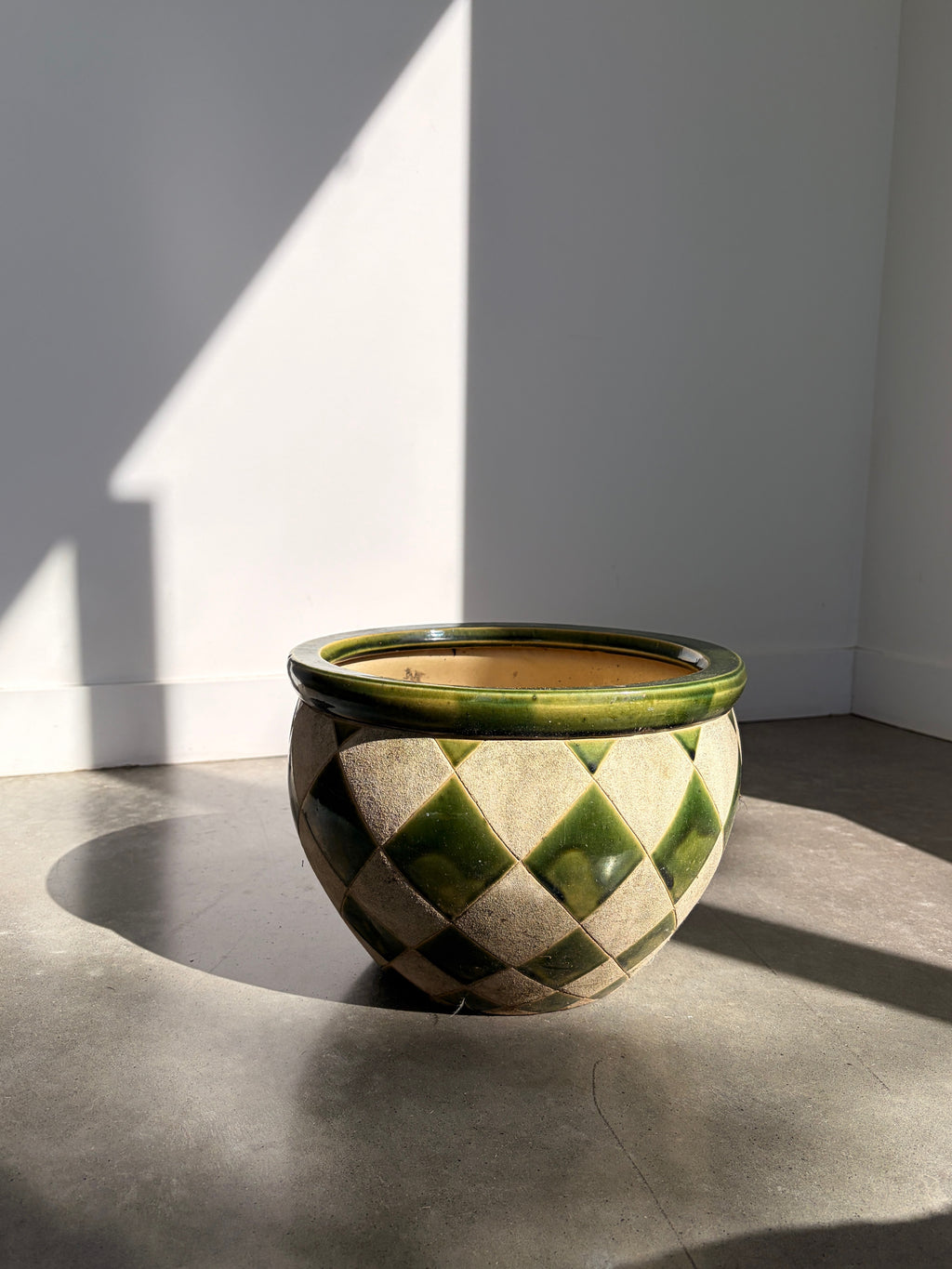 Green and cream harlequin ceramic pot top view