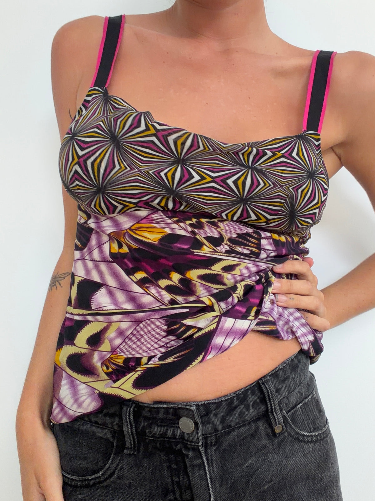 Close view of contrasting geometric and abstract prints on camisole
