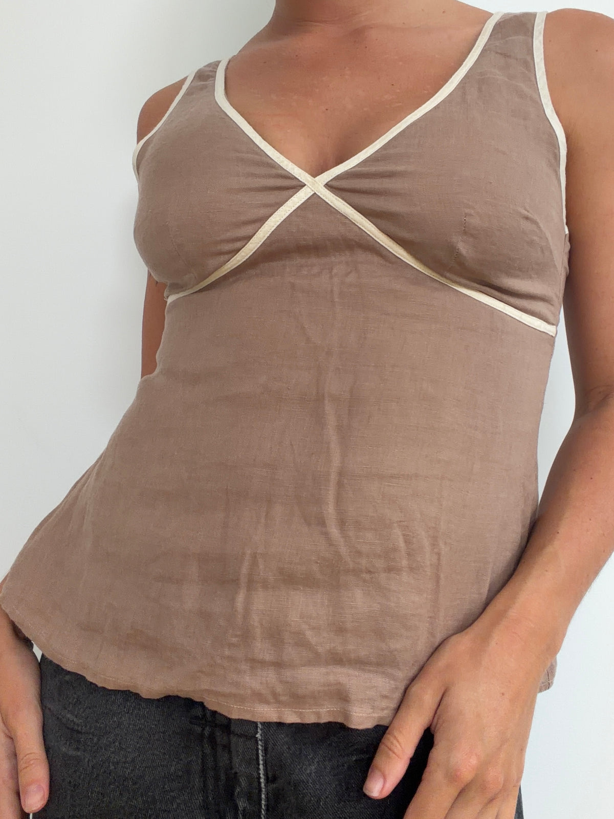 Close front view of taupe contrast-trim top