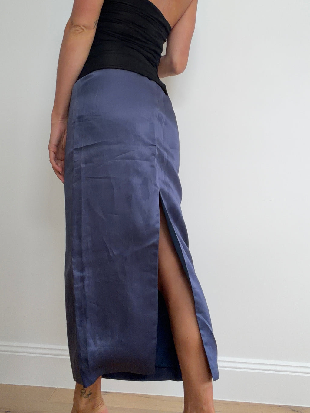 Rear view of blue skirt showing back slit