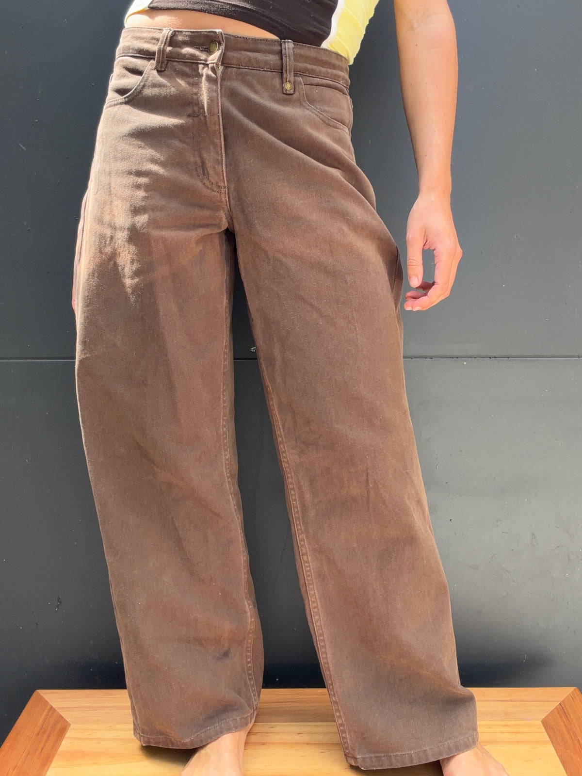 Angled front view of washed brown THRILLS Billy jeans