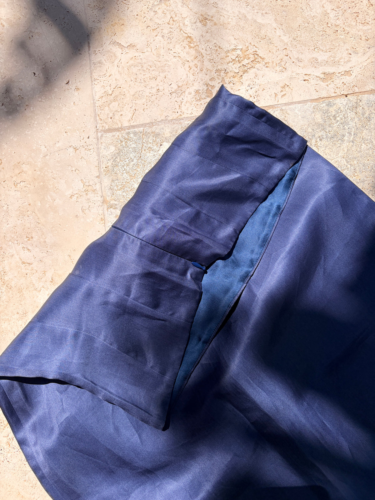 Detail of blue skirt fabric and waist shaping